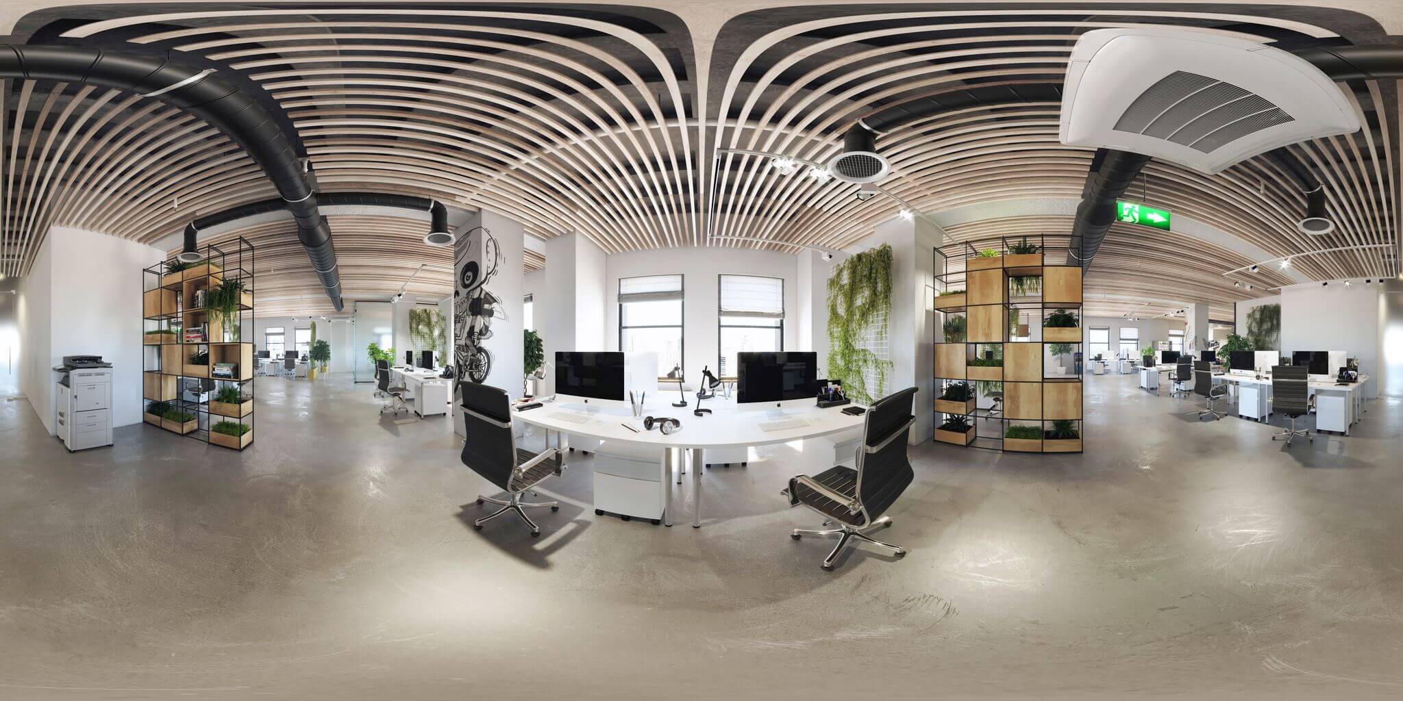 Une image 360 d'un espace de bureau commercial avec de grands bureaux et des ordinateurs Mac